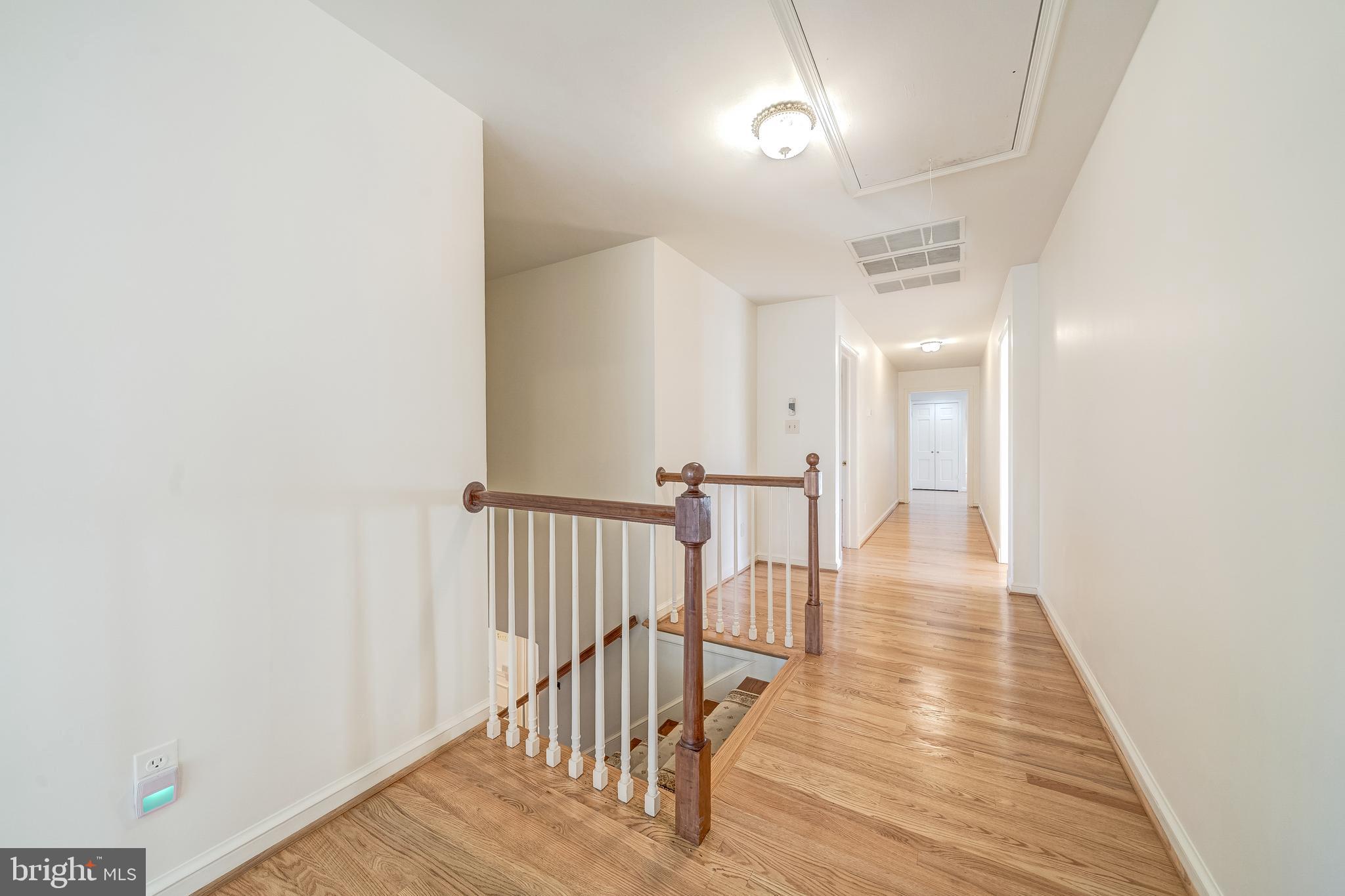 6209 Stoneham Lane McLean, VA 22101 - Photo 27 of 49 a view of a hallway with wooden floor