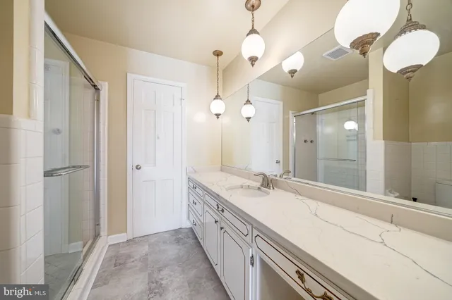 a view of an empty room and wooden floor