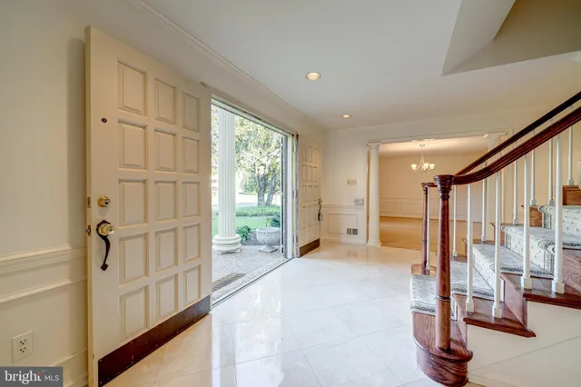 a view of a hallway with staircase