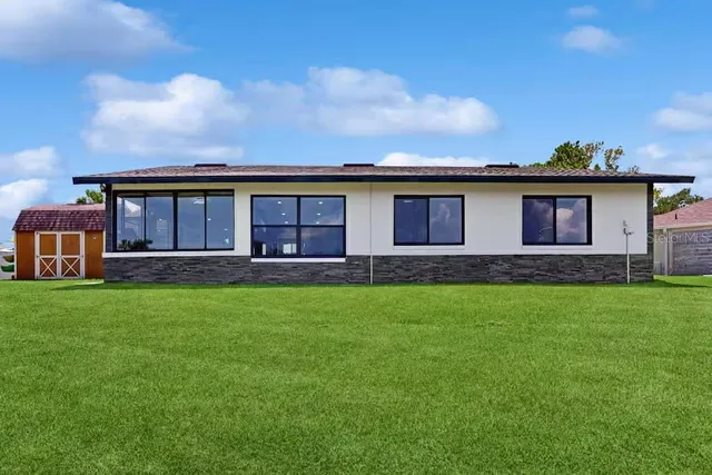 front view of a house with a garden