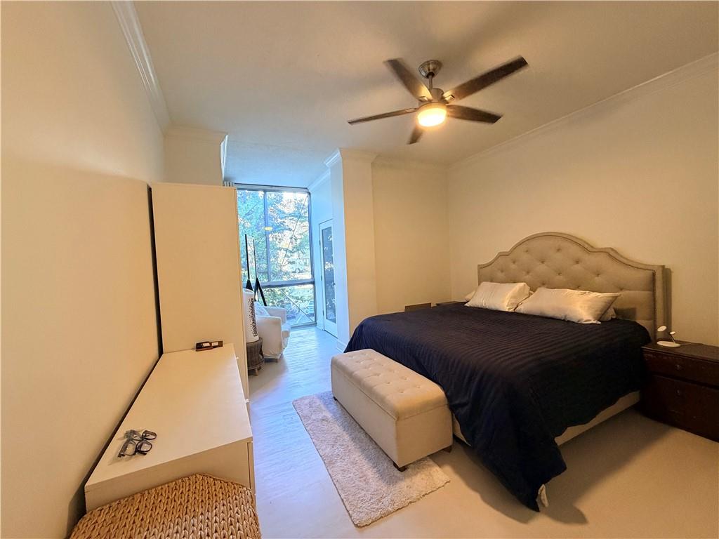 130 Twenty 6th Street, Unit 214 Atlanta, GA 30344 - Photo 15 of 42 a bedroom with a bed and window