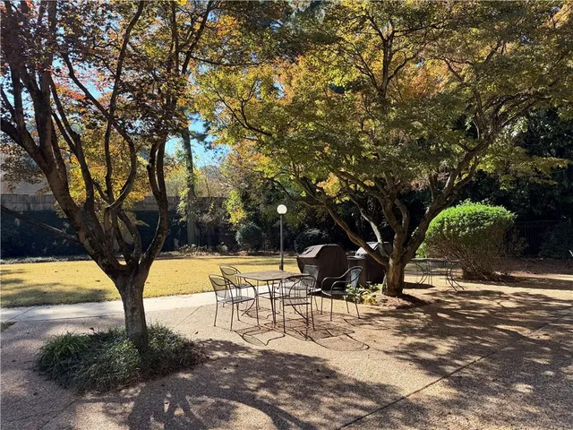 a view of a yard and basketball court