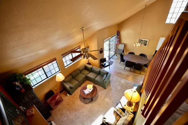 a view of living room with furniture and a rug