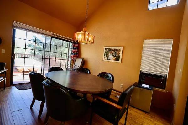 a dining room with furniture and window