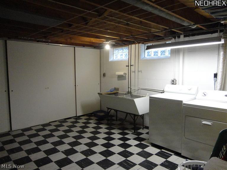 12116 Grannis Road Garfield Heights, OH 44125 - Photo 7 of 14 Spacious laundry room with loads of storage! Washer & Dryer included!
