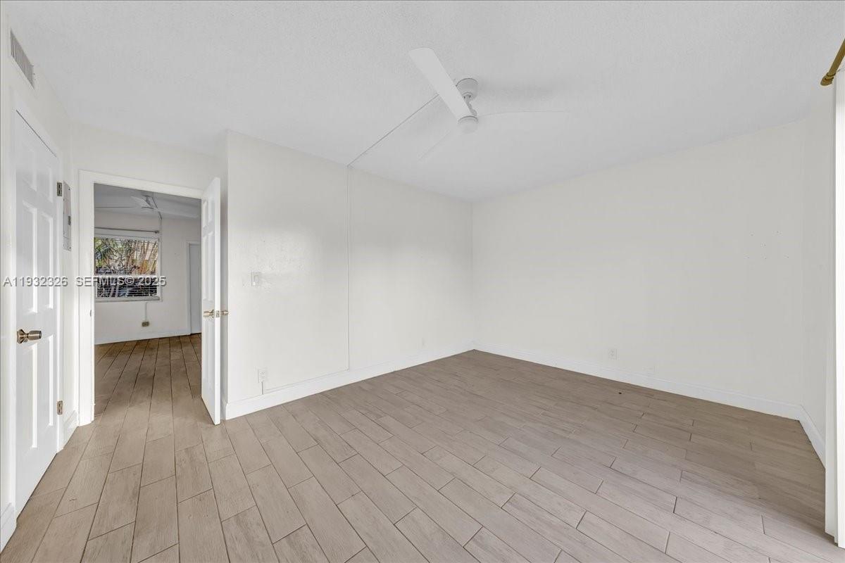 2025 Miami Road, Unit 19 Fort Lauderdale, FL 33316 - Photo 18 of 30 wooden floor in a empty room
