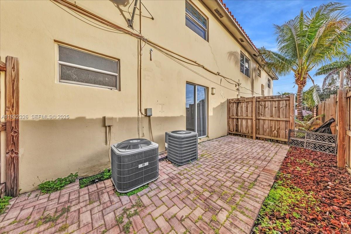 2025 Miami Road, Unit 19 Fort Lauderdale, FL 33316 - Photo 25 of 30 a picture of a brick house with many windows