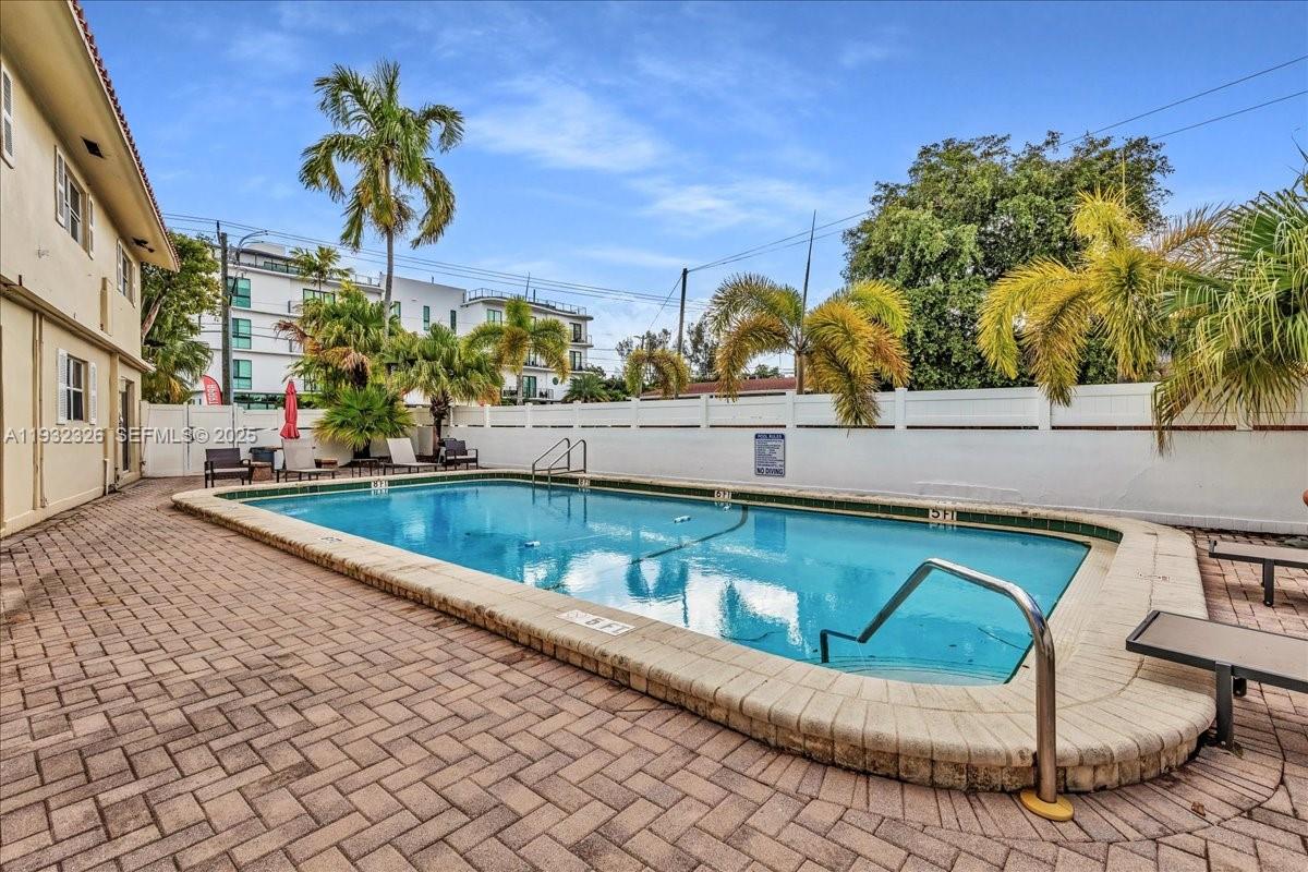 2025 Miami Road, Unit 19 Fort Lauderdale, FL 33316 - Photo 28 of 30 a view of a swimming pool with a patio