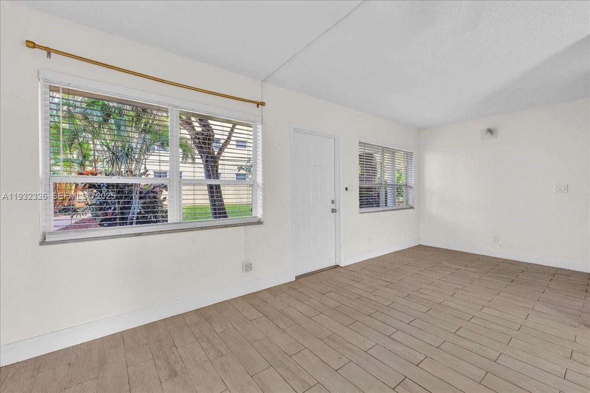2025 Miami Road, Unit 19 Fort Lauderdale, FL 33316 - Photo 9 of 30 a view of an empty room with a window