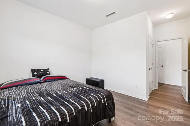 a bedroom with a bed and a walk in closet