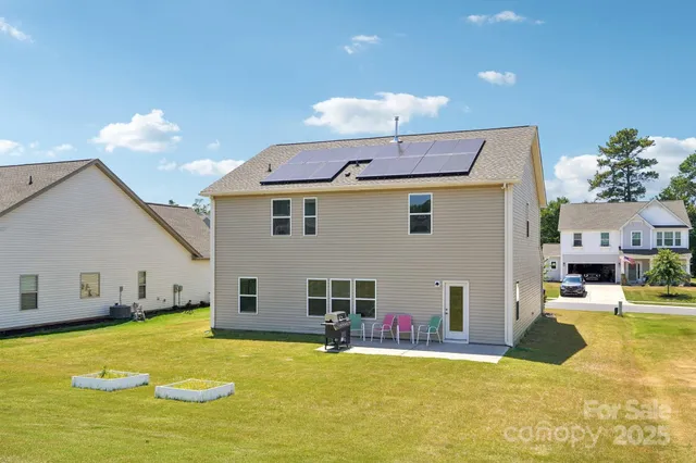 a view of a kitchen with a table and chairs