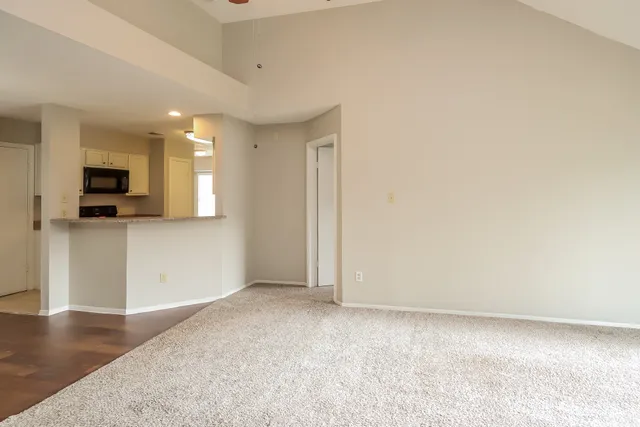 a view of a kitchen with microwave and cabinets