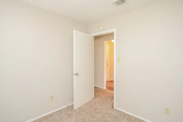 a view of a room with a hallway