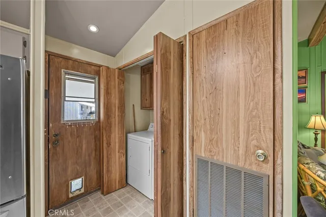 a view of a bathroom with shower and closet area