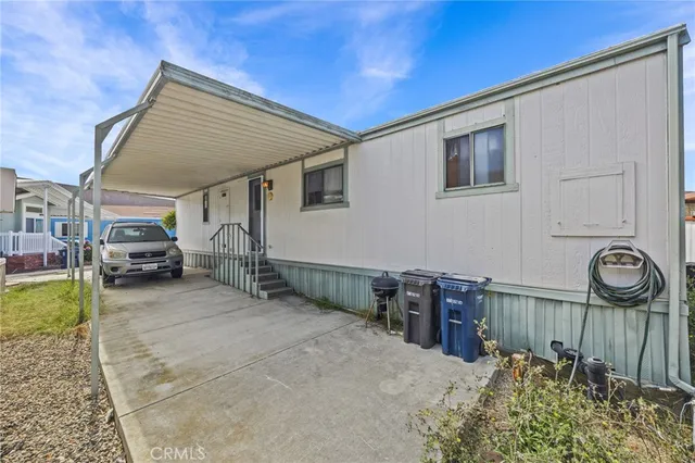 a view of a house with a couches and a table
