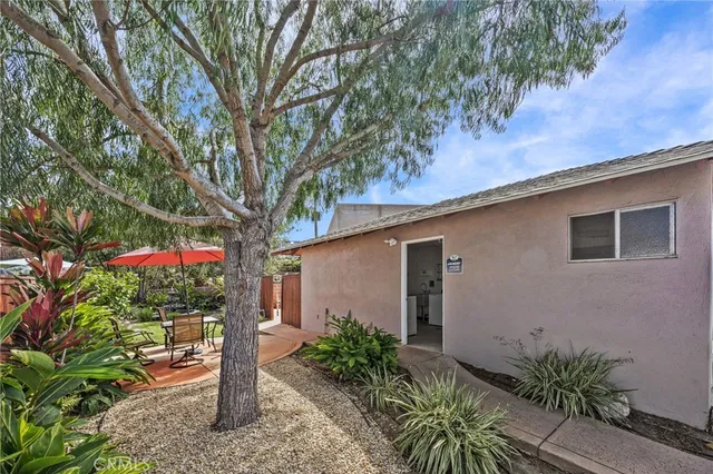 a sign that is sitting in front of a house