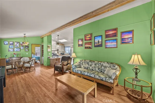 a living room with furniture and a lamp