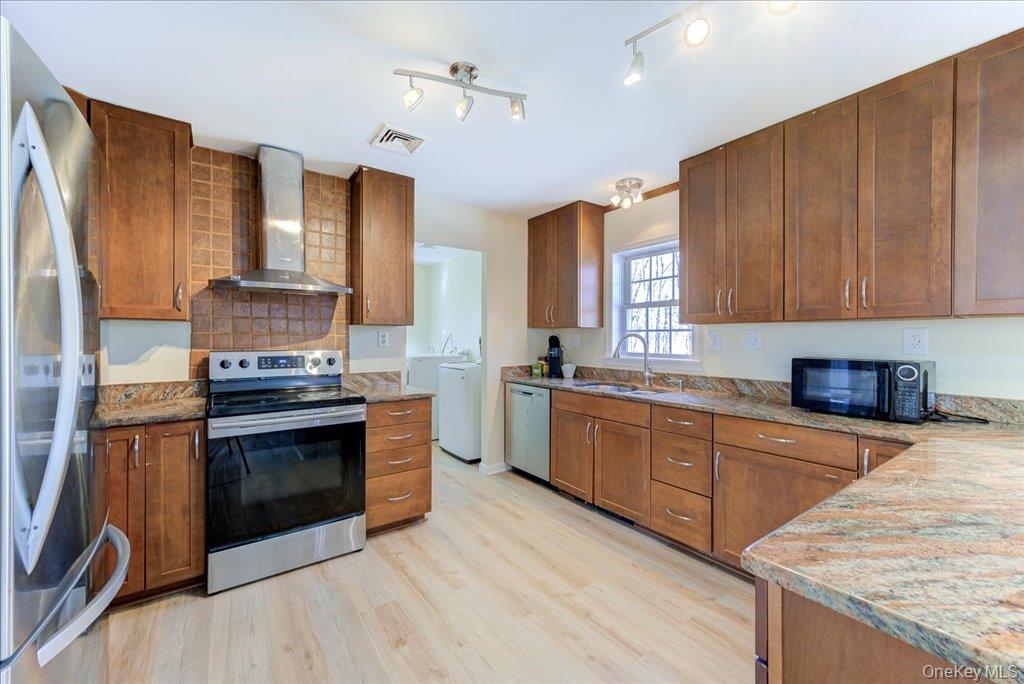 237 South Ohioville Road New Paltz, NY 12561 - Photo 12 of 48 a kitchen with stainless steel appliances granite countertop a stove a sink and a refrigerator