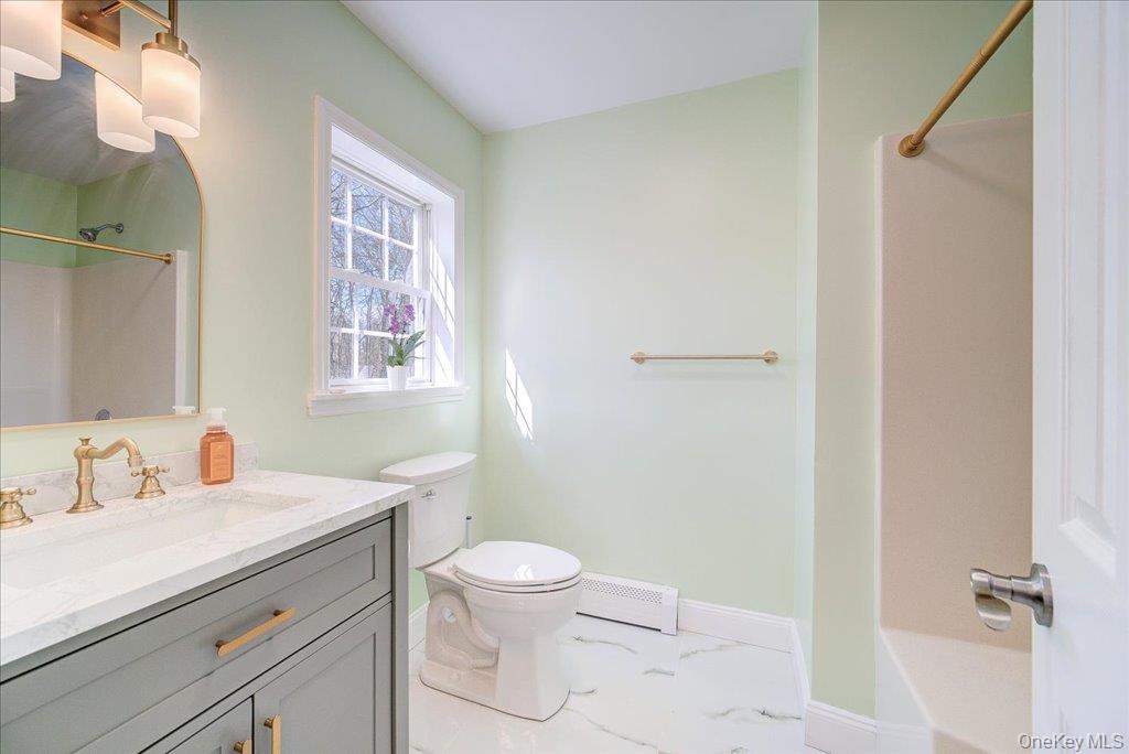 237 South Ohioville Road New Paltz, NY 12561 - Photo 17 of 48 a bathroom with a sink a toilet and shower