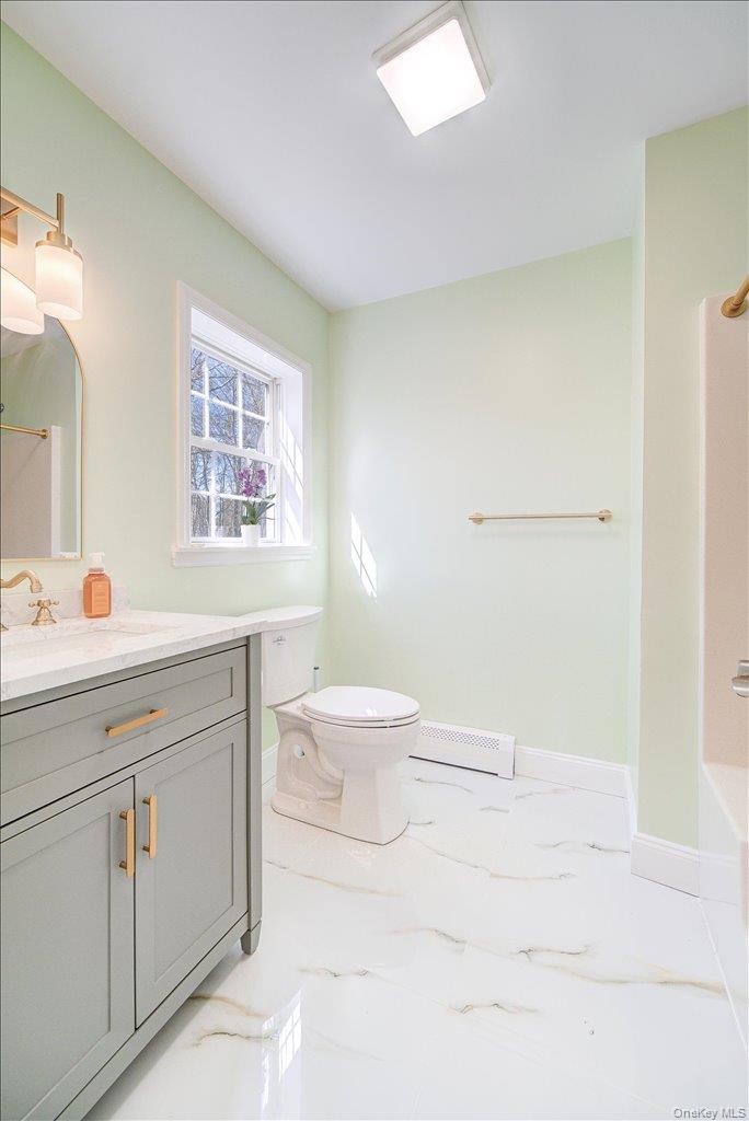 237 South Ohioville Road New Paltz, NY 12561 - Photo 18 of 48 a bathroom with a sink a toilet and a window