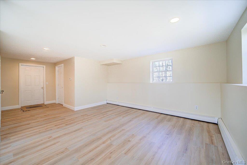 237 South Ohioville Road New Paltz, NY 12561 - Photo 31 of 48 an empty room with wooden floor and windows
