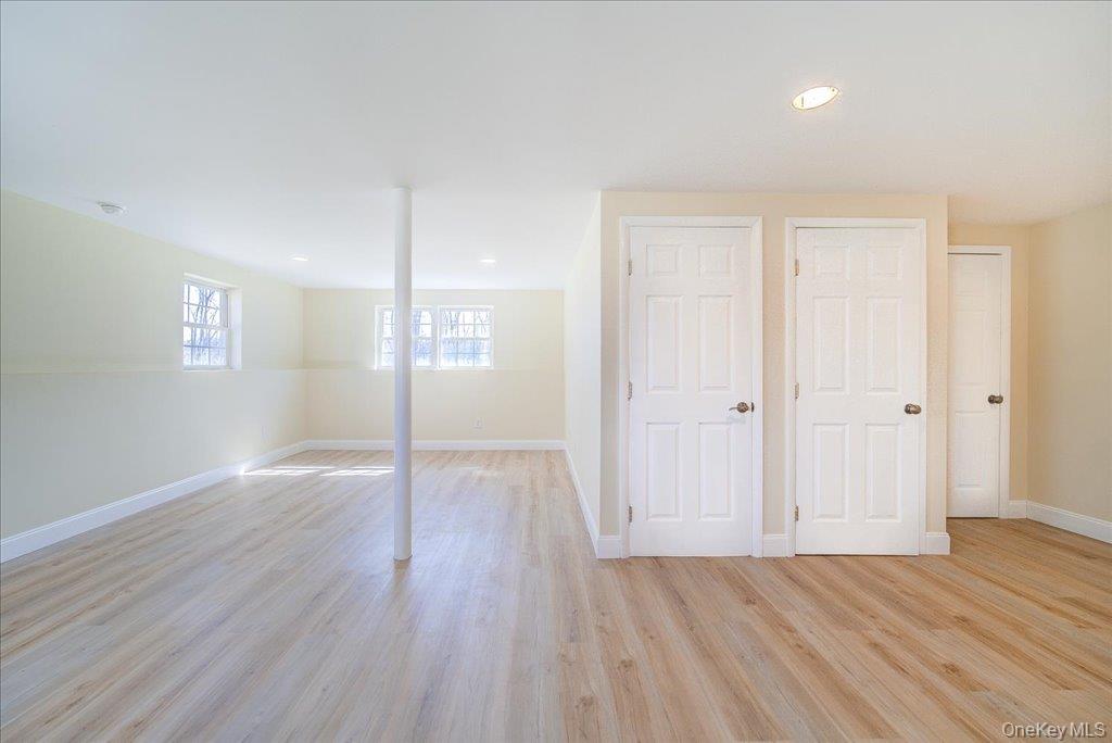 237 South Ohioville Road New Paltz, NY 12561 - Photo 34 of 48 an empty room with wooden floor and windows