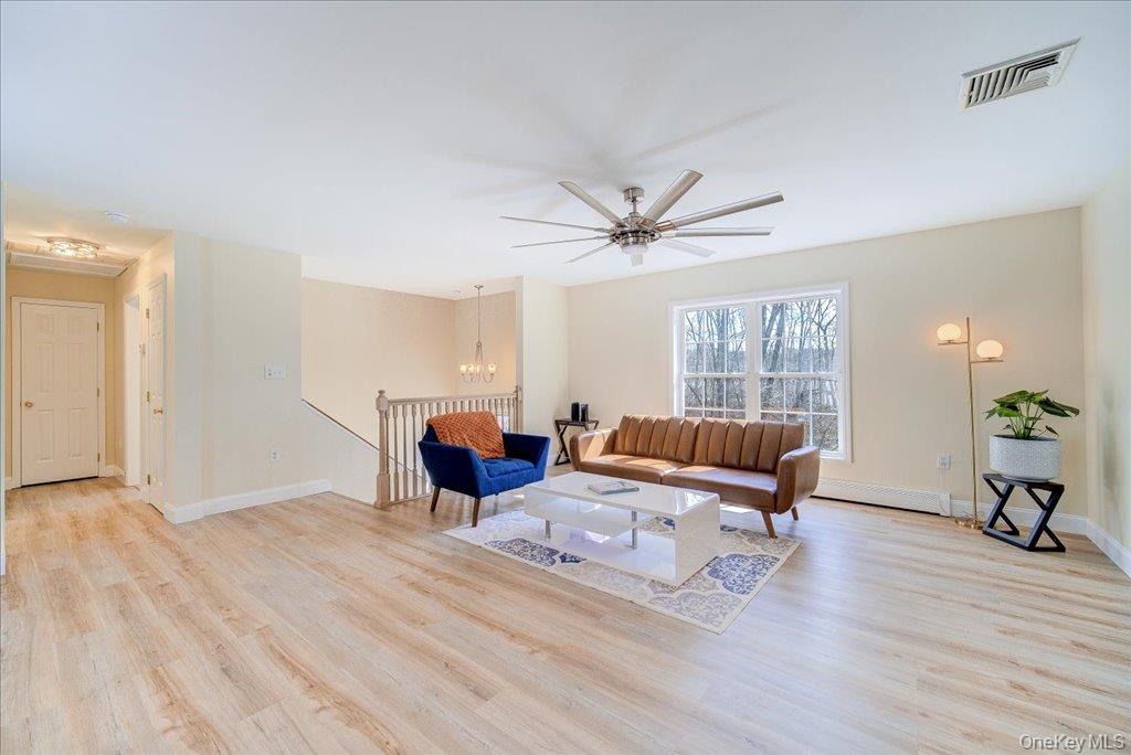 237 South Ohioville Road New Paltz, NY 12561 - Photo 7 of 48 a living room with furniture and a wooden floor