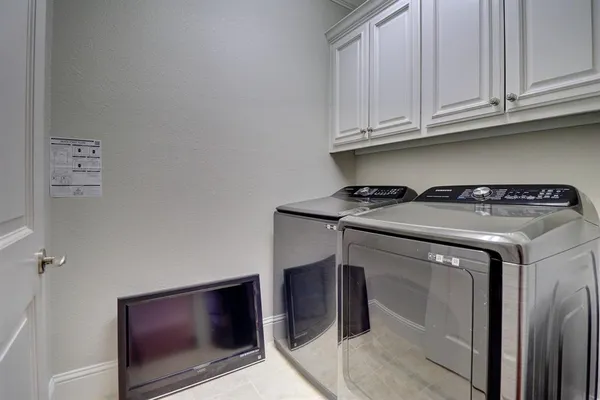 a utility room with washer and dryer