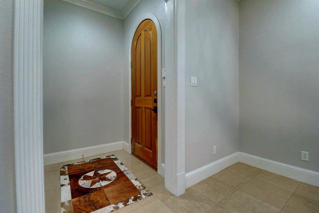 5606 Pershing Avenue Fort Worth, TX 76107 - Photo 2 of 12 an empty room with a door
