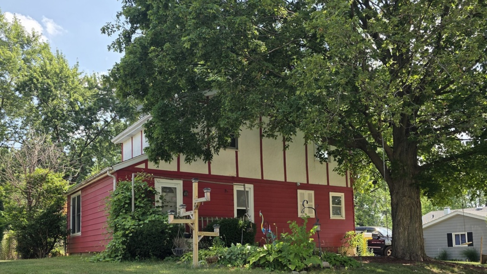 front view of a house with a tree