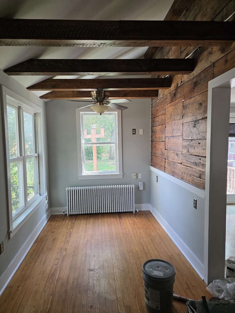 302 Dee Road North Aurora, IL 60542 - Photo 9 of 13 a view of empty room with wooden floor