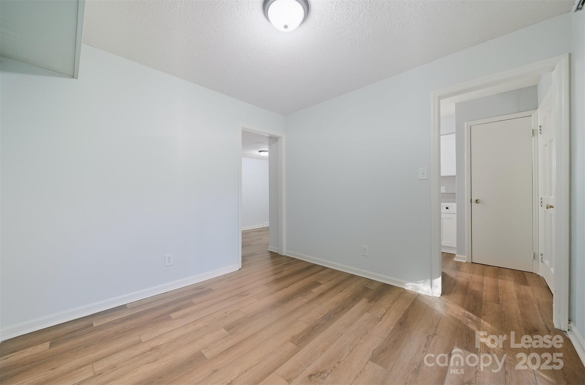824 6th Street Northwest Hickory, NC 28601 - Photo 14 of 38 a view of an empty room with wooden floor
