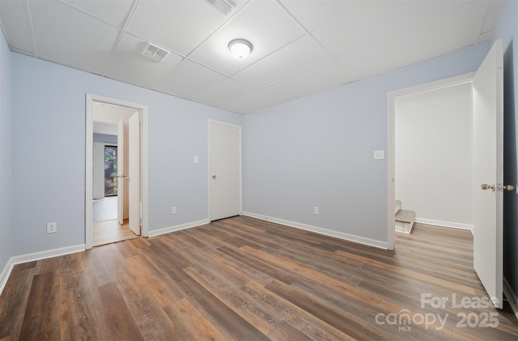 824 6th Street Northwest Hickory, NC 28601 - Photo 28 of 38 an empty room with wooden floor and windows
