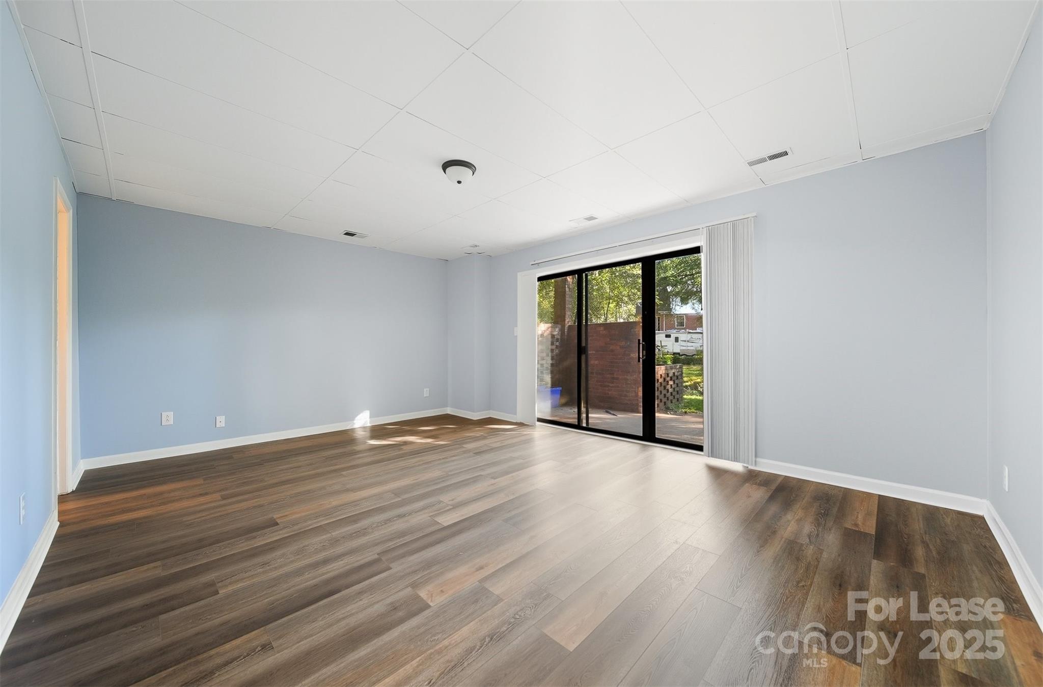 824 6th Street Northwest Hickory, NC 28601 - Photo 31 of 38 a view of an empty room with wooden floor and a window