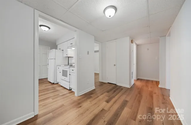 a view of kitchen with wooden floor