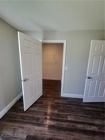 a view of an entryway with wooden floor