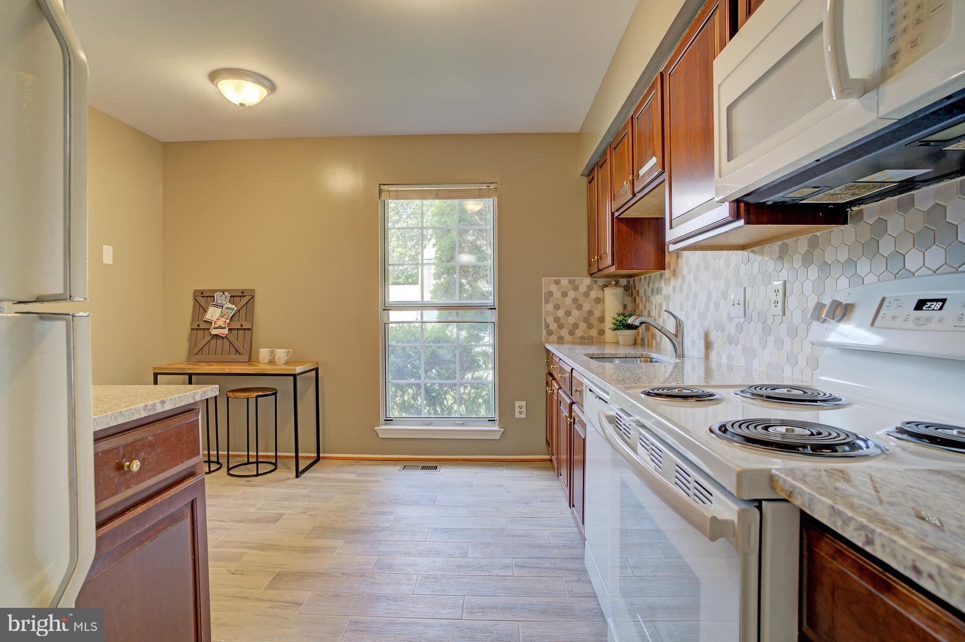 5994 Powell's Landing Road Burke, VA 22015 - Photo 28 of 31 New stove, microwave, dishwasher
