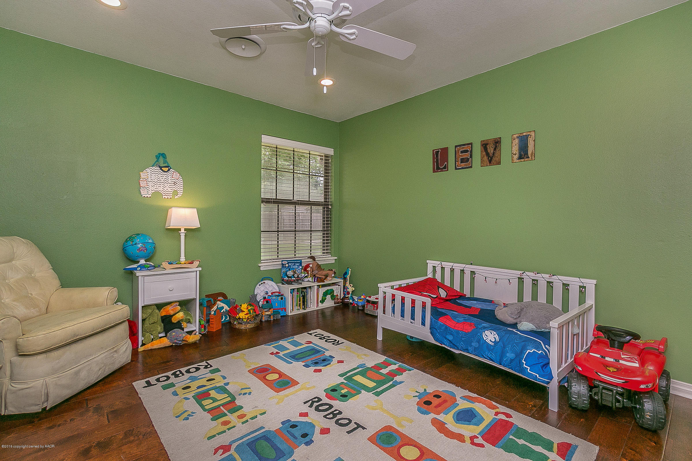7109 Jameson Road Amarillo, TX 79106 - Photo 17 of 25 a kids room with toys and a wooden floor