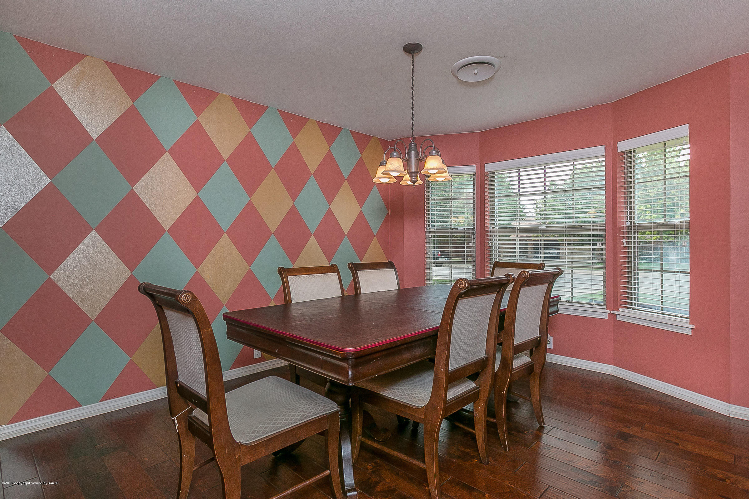 7109 Jameson Road Amarillo, TX 79106 - Photo 7 of 25 a view of a dining room with furniture and chandelier