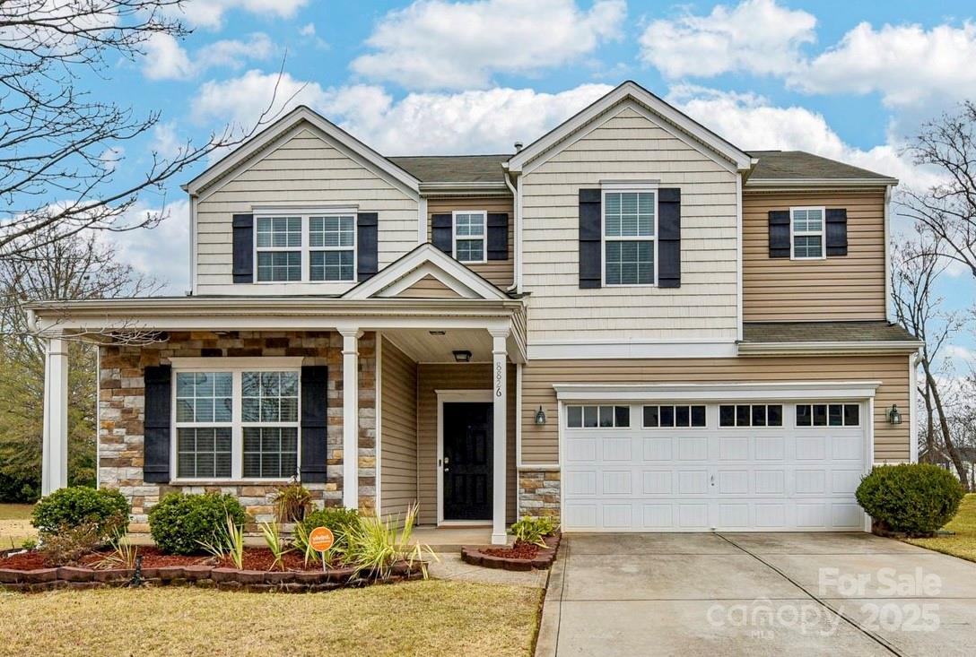 8826 Gray Willow Road Charlotte, NC 28227 - Photo 1 of 47 a front view of a house with garden
