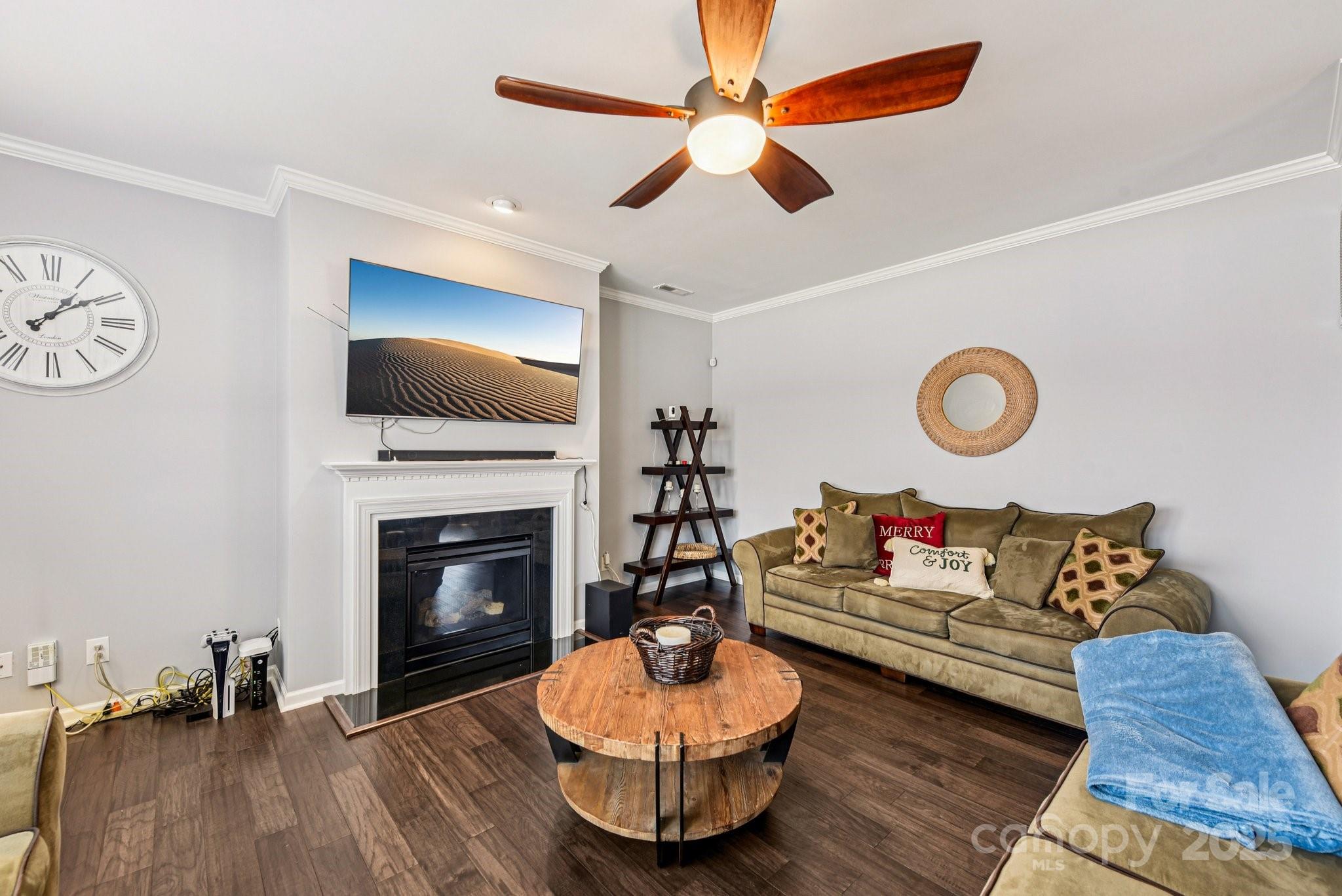 8826 Gray Willow Road Charlotte, NC 28227 - Photo 16 of 47 a living room with furniture and a fireplace