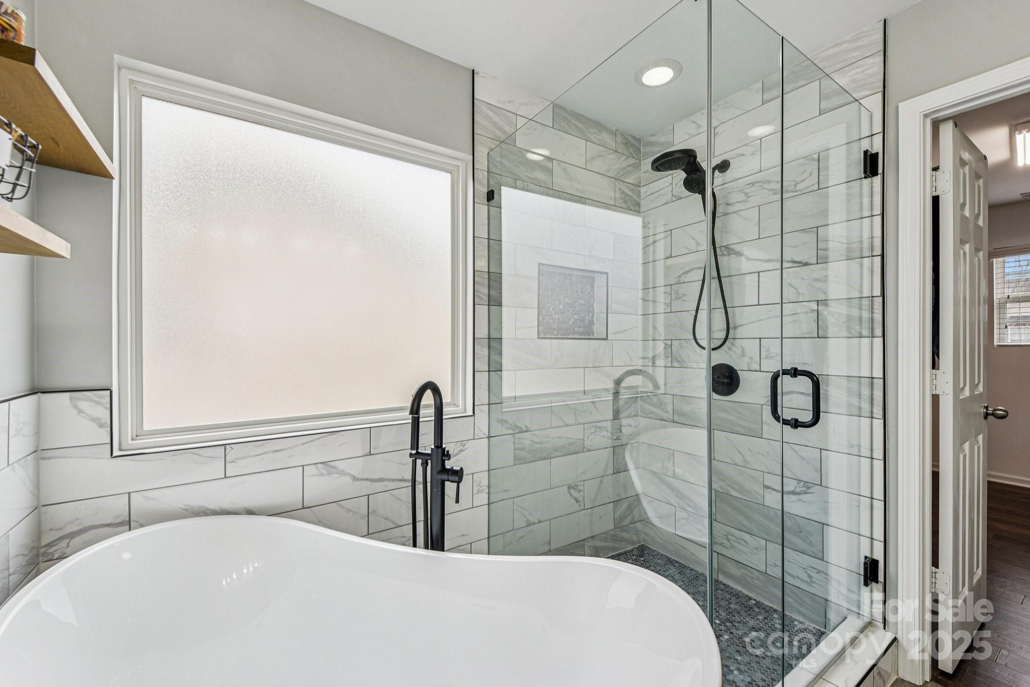 8826 Gray Willow Road Charlotte, NC 28227 - Photo 23 of 47 a bathroom with a bathtub and shower