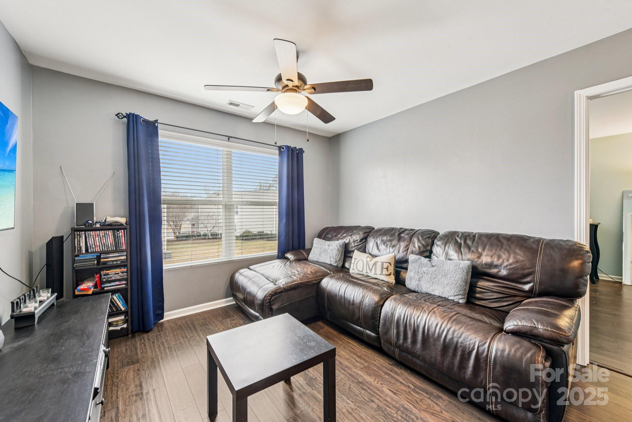 8826 Gray Willow Road Charlotte, NC 28227 - Photo 25 of 47 a living room with furniture and a flat screen tv