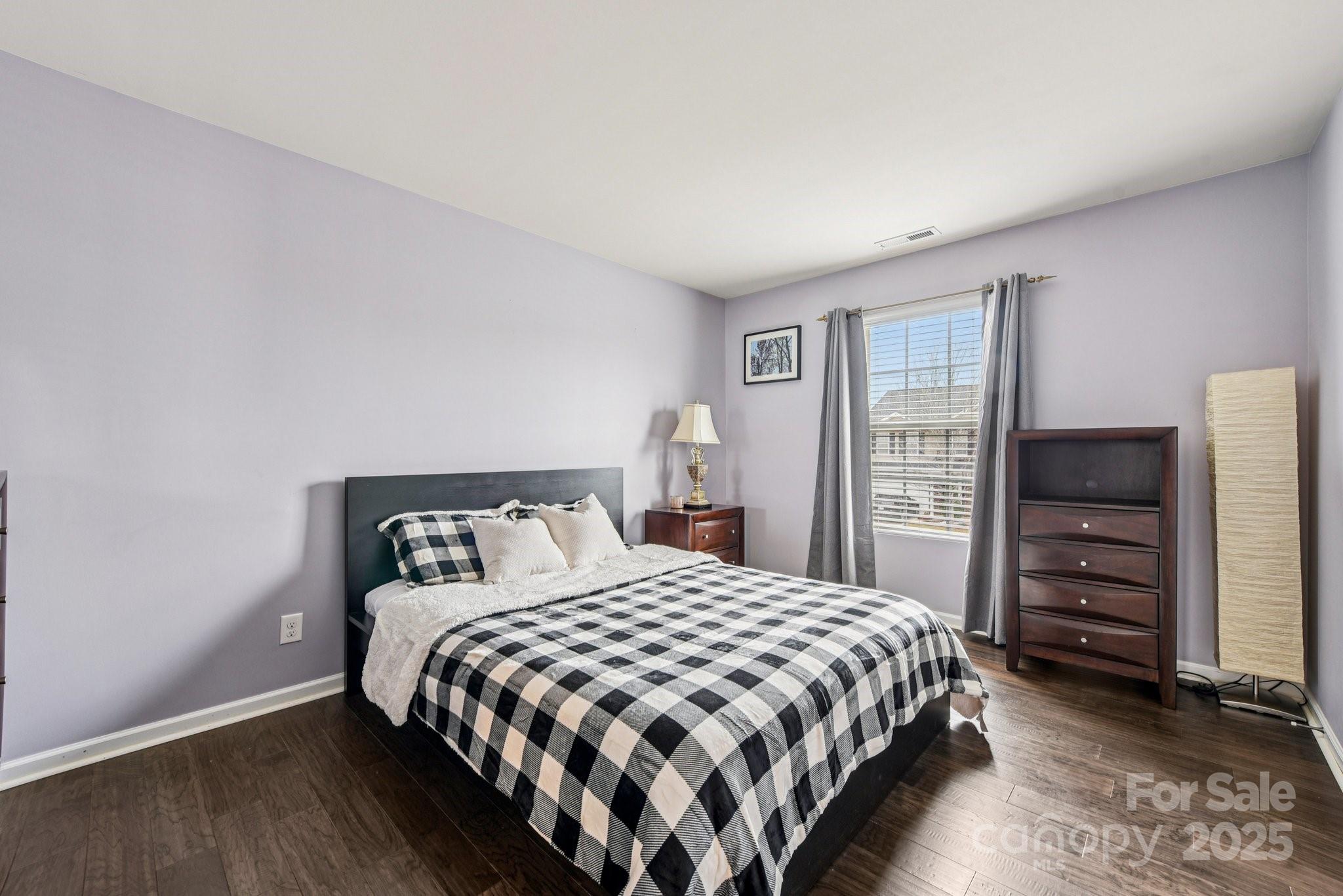 8826 Gray Willow Road Charlotte, NC 28227 - Photo 28 of 47 a bedroom with a bed and a closet