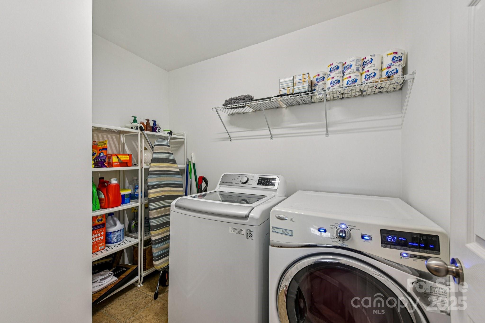 8826 Gray Willow Road Charlotte, NC 28227 - Photo 35 of 47 a utility room with dryer washer and empty racks
