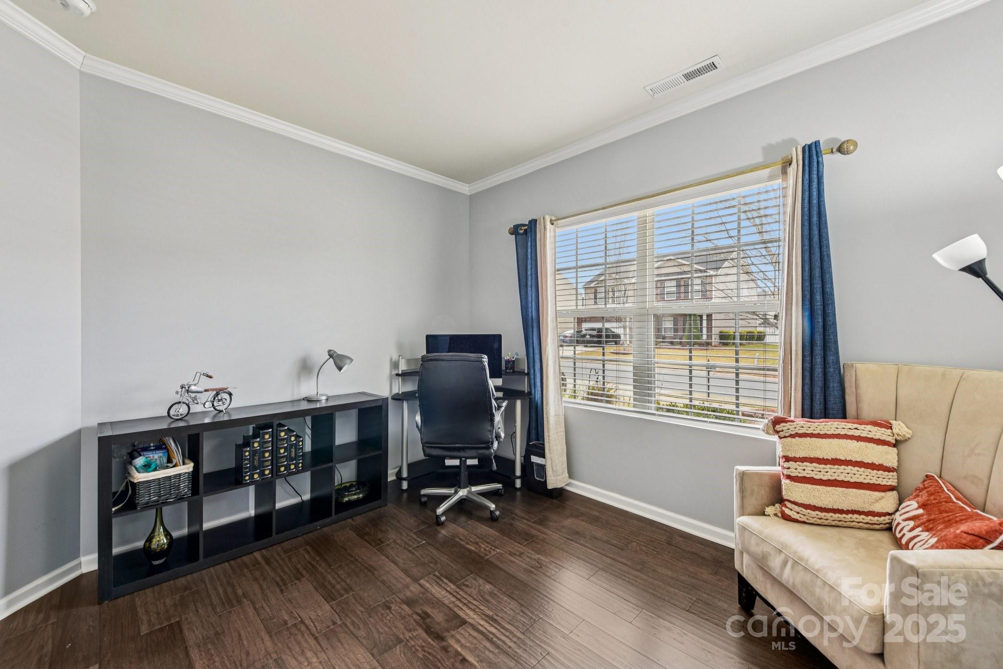 8826 Gray Willow Road Charlotte, NC 28227 - Photo 6 of 47 a view of a workspace with furniture and a window