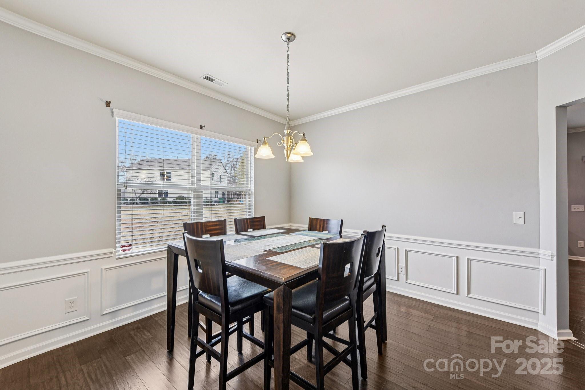8826 Gray Willow Road Charlotte, NC 28227 - Photo 8 of 47 a view of a dining room with furniture window and wooden floor