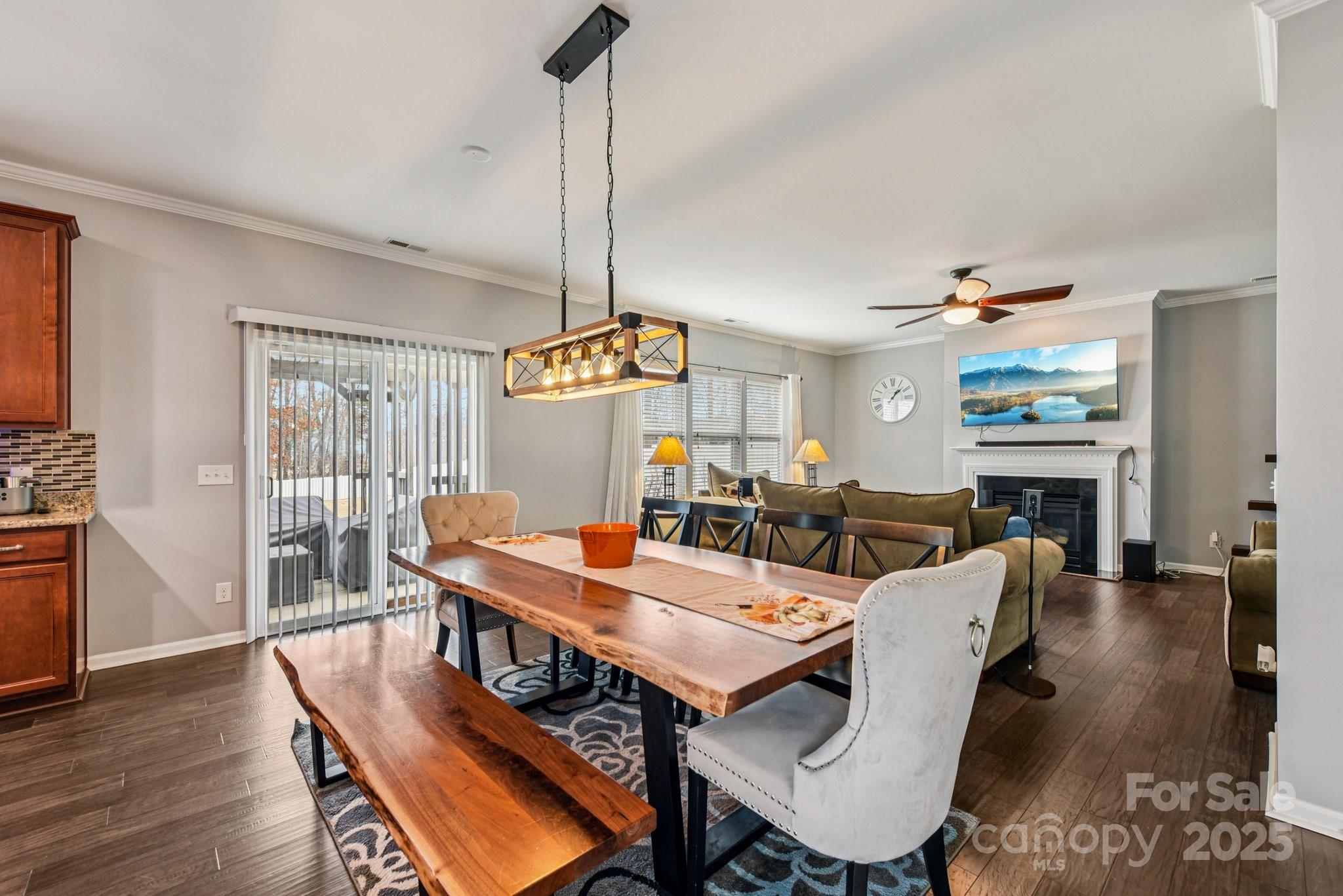 8826 Gray Willow Road Charlotte, NC 28227 - Photo 9 of 47 a view of a dining room with furniture wooden floor and chandelier