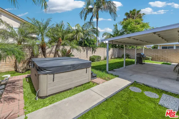a view of a house with a backyard porch and sitting area