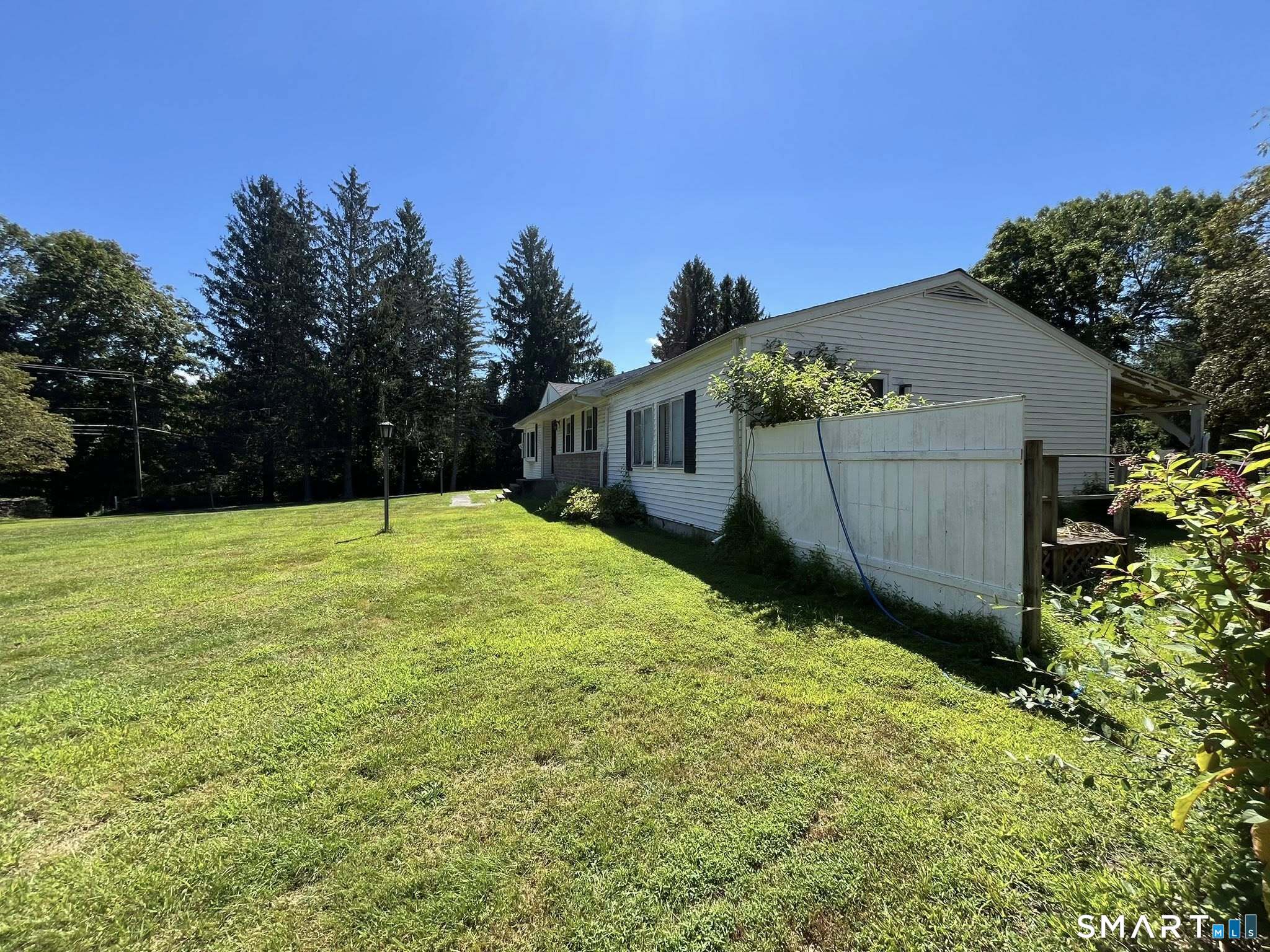 62 Old Hawleyville Road Bethel, CT 06801 - Photo 38 of 46 a view of a backyard with a garden
